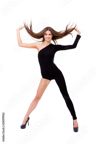 Young woman with flowing hair dancing