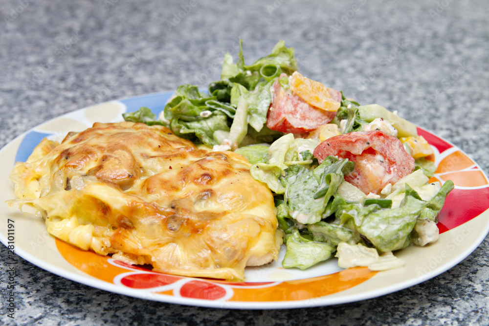 chicken breast baked under cheese with salad chicken breast baked under cheese with salad