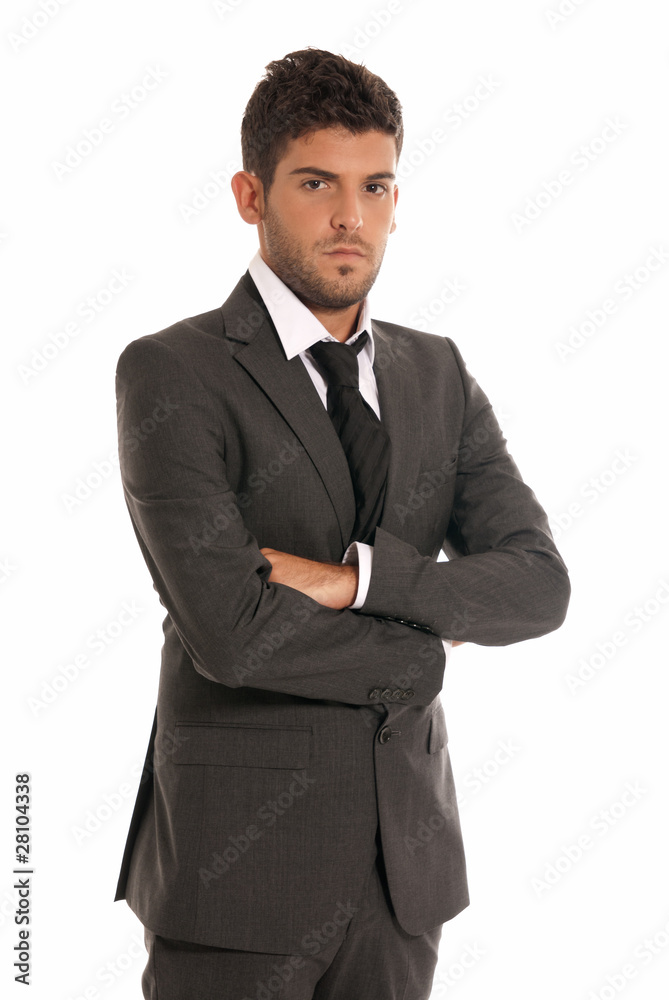 Young businessman looking serious arms crossed isolated Young businessman looking serious arms crossed isolated