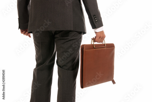 Unrecognizable businessman back with suitcase isolated on white