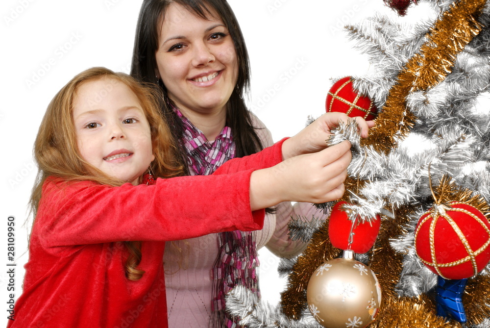 Two Young happy woman decorating the Christmas tree