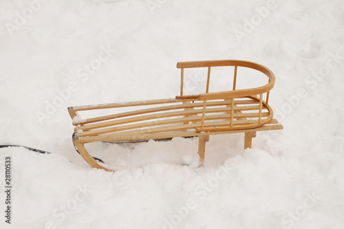 Wooden sledge in the snow