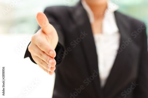 Business woman giving handshake