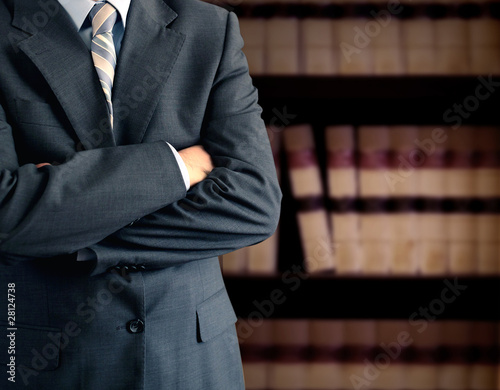 Businessman in front of books