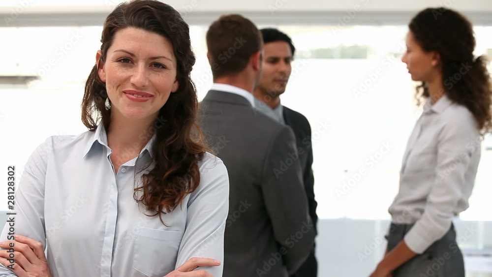 Businesswoman presenting her team Businesswoman presenting her team