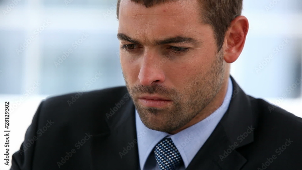 Serious businessman on a laptop become happy Serious businessman on a laptop become happy