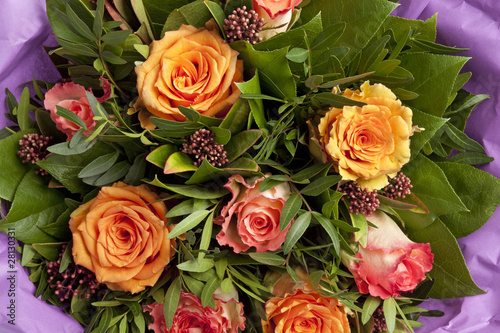 Bouquet of pink and orange roses full frame