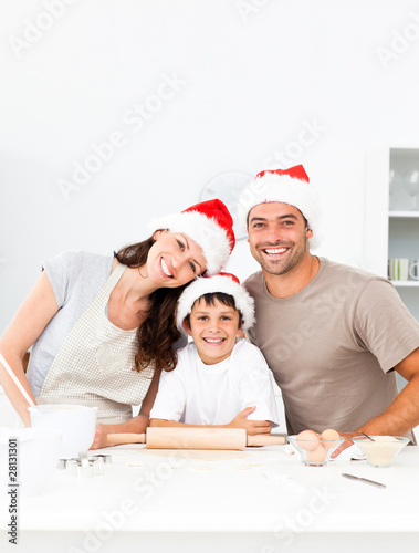 Happy family baking christmas cookies together
