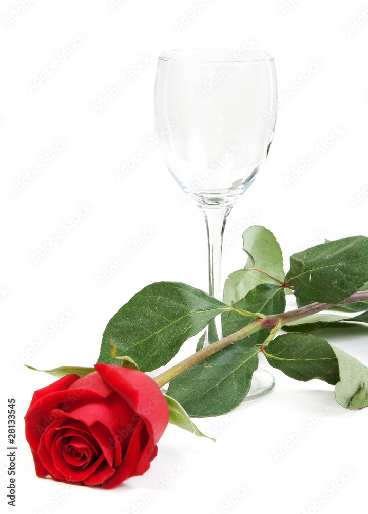 Red rose and a glass cup Red rose and a glass cup