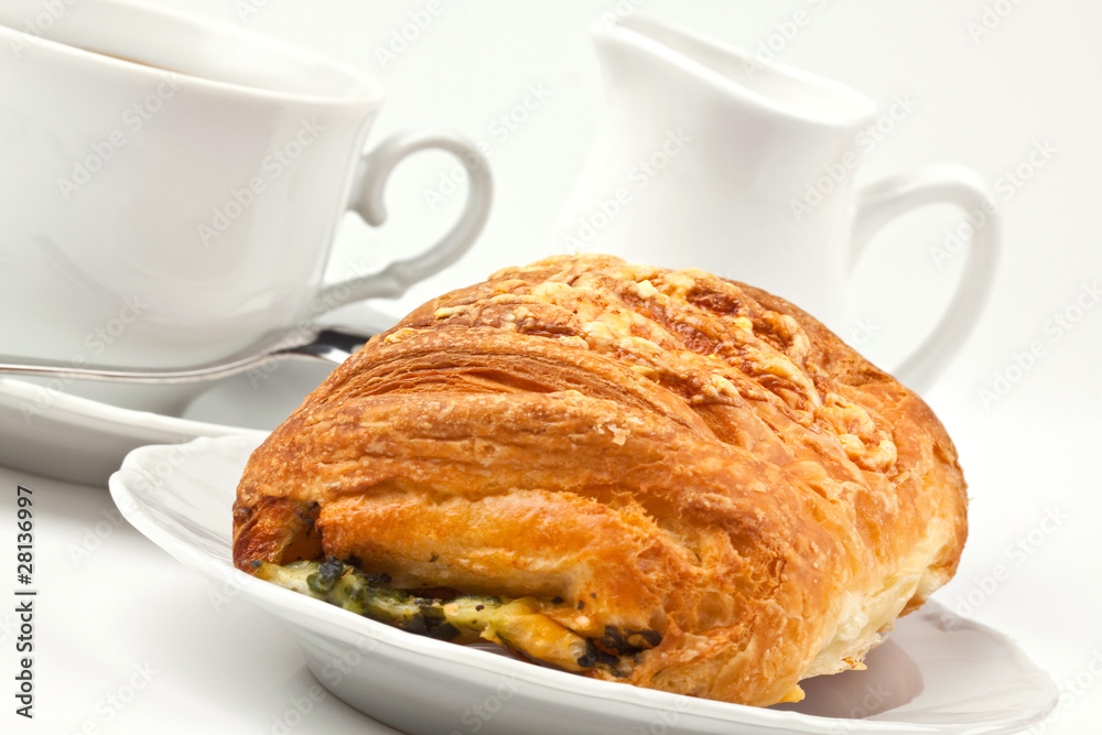 Breakfast: coffee and bun with cheese and spinach Breakfast: coffee and bun with cheese and spinach