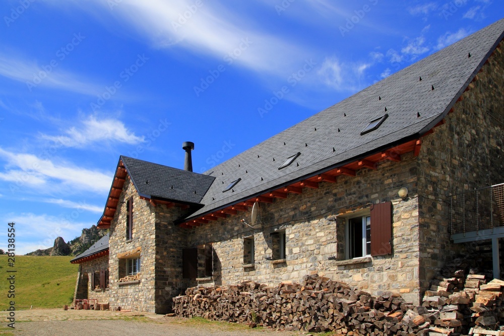 Mountain stone house slate roof in Pyrenees Mountain stone house slate roof in Pyrenees
