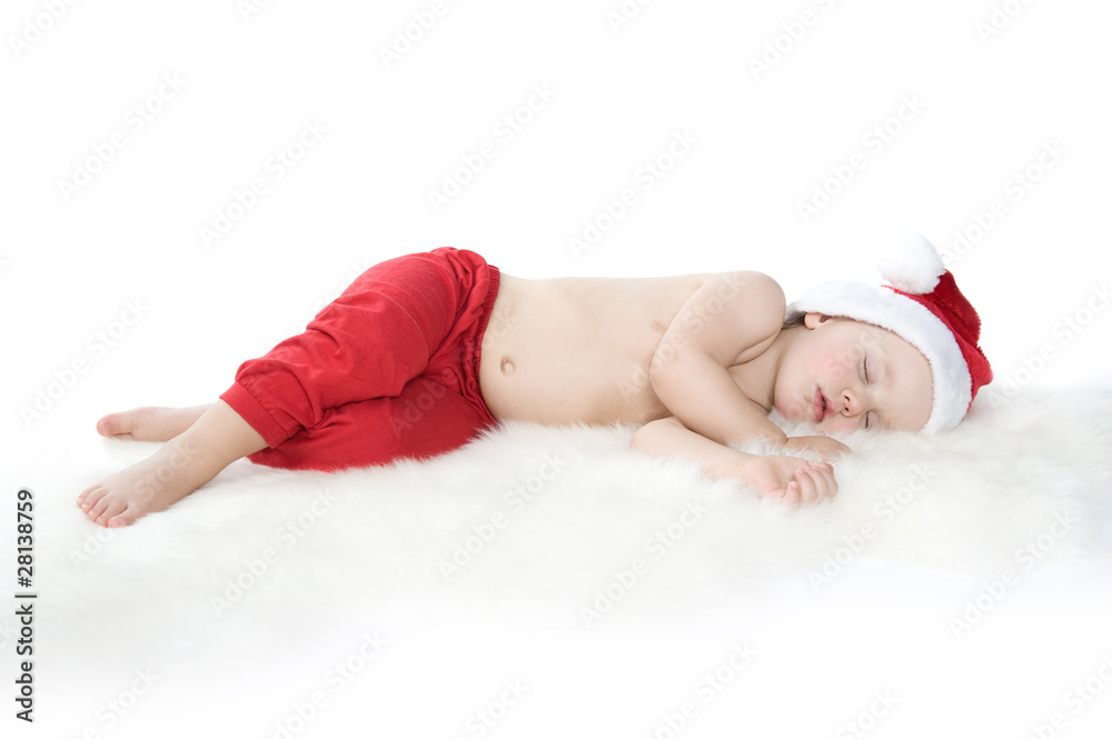 Baby in christmas suit is sleeping on white background Baby in christmas suit is sleeping on white background
