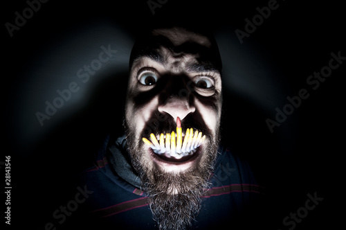 monstrous man with long teeth