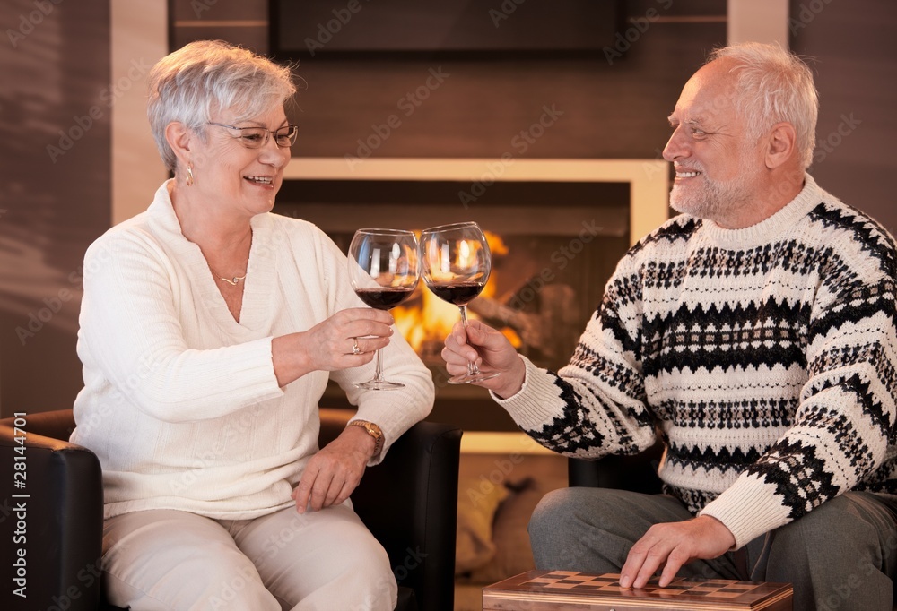 Retired husband and wife drinking wine together Retired husband and wife drinking wine together