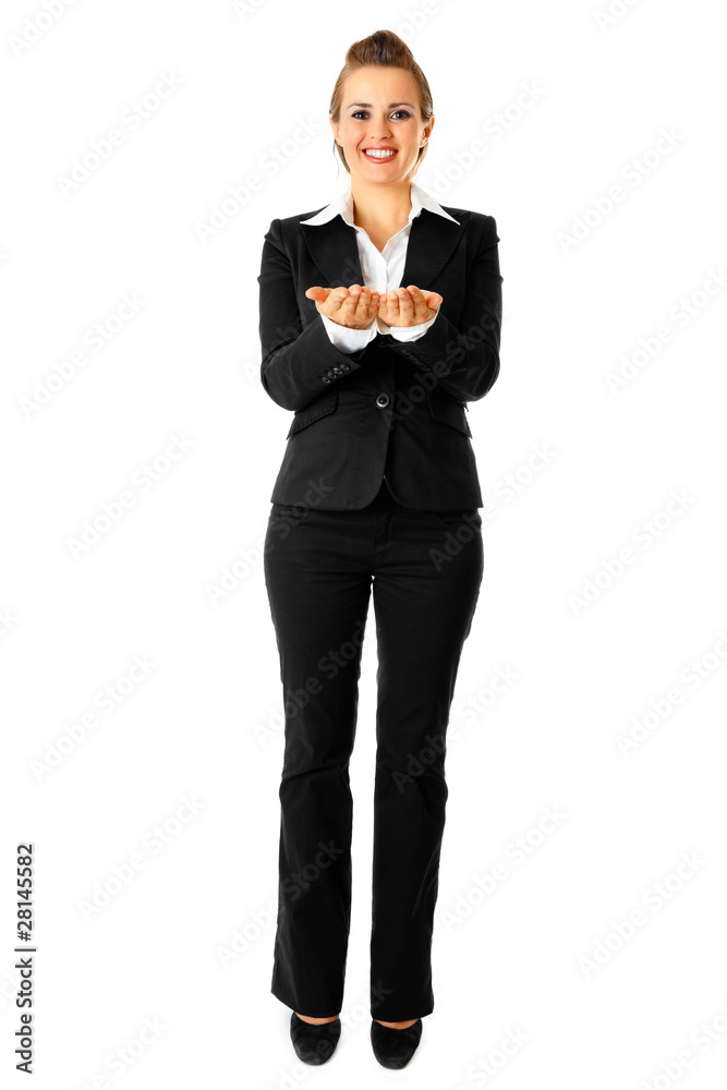 Smiling business woman presenting something on empty hands Smiling business woman presenting something on empty hands