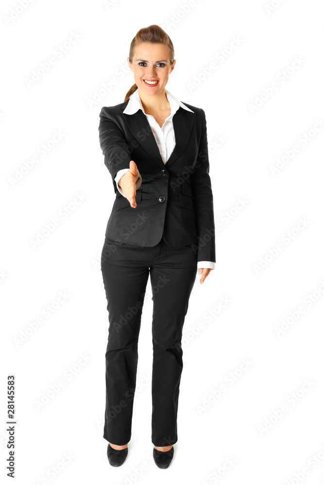 Smiling modern business woman stretches out hand for handshake Smiling modern business woman stretches out hand for handshake