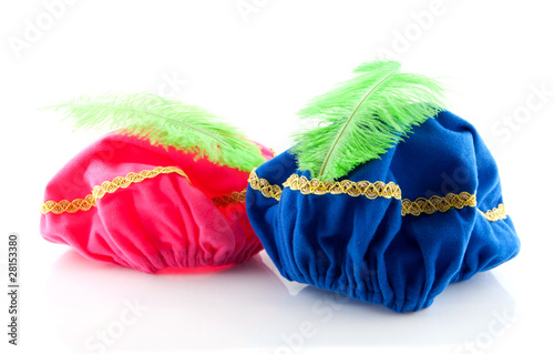 pink and blue hat with green feather of Zwarte Piet