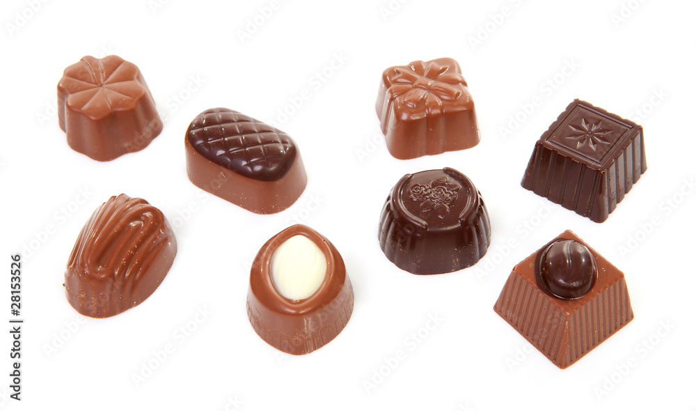 chocolate bonbons over white background