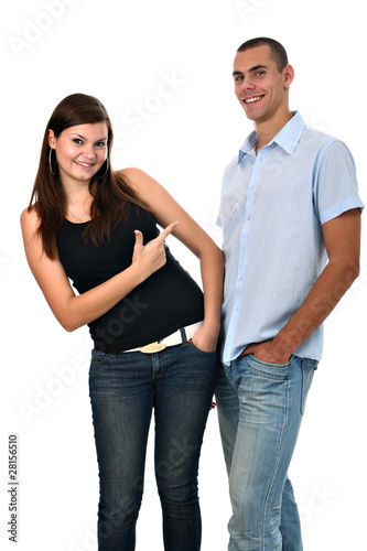 Young girl points her finger to her boyfriend isolated on white