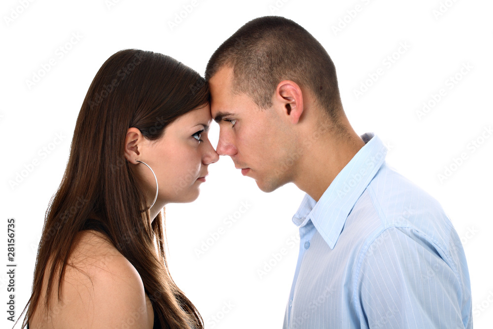 Young couple in head-to-head position isolated on white Young couple in head-to-head position isolated on white