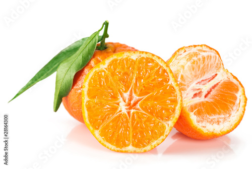 Ripe tangerines with leaves over white background © PerfectLazybones