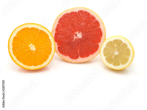 half of orange, lemon and grapefruit on white background