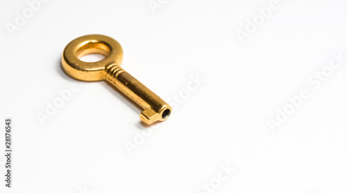 Golden key isolated on white © Minerva Studio