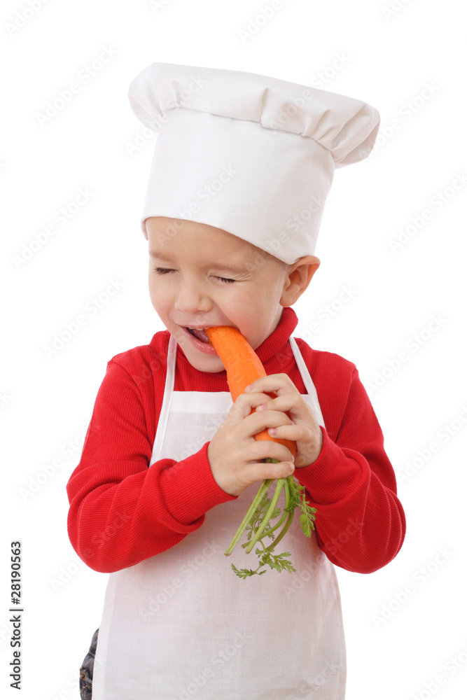 Little chief-cook tasting the carrot, isolated on white Little chief-cook tasting the carrot, isolated on white