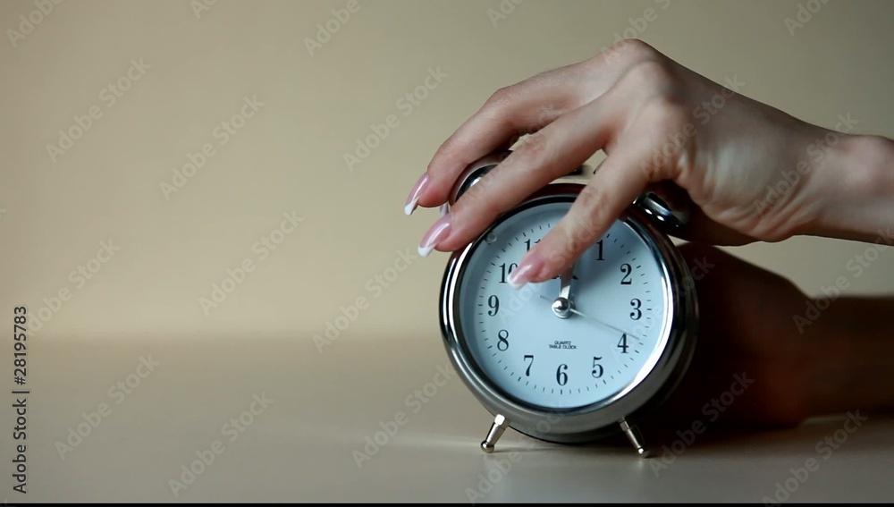 The alarm clock rings