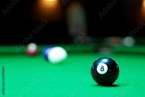 Eight ball on pool table