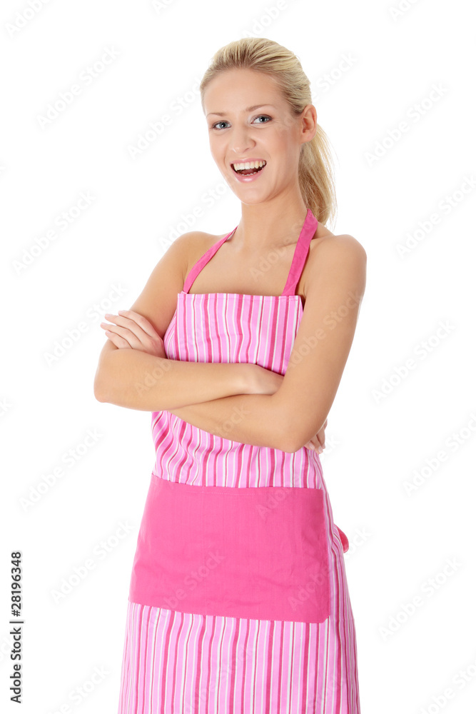 Happy blond nude woman in pink apron Happy blond nude woman in pink apron