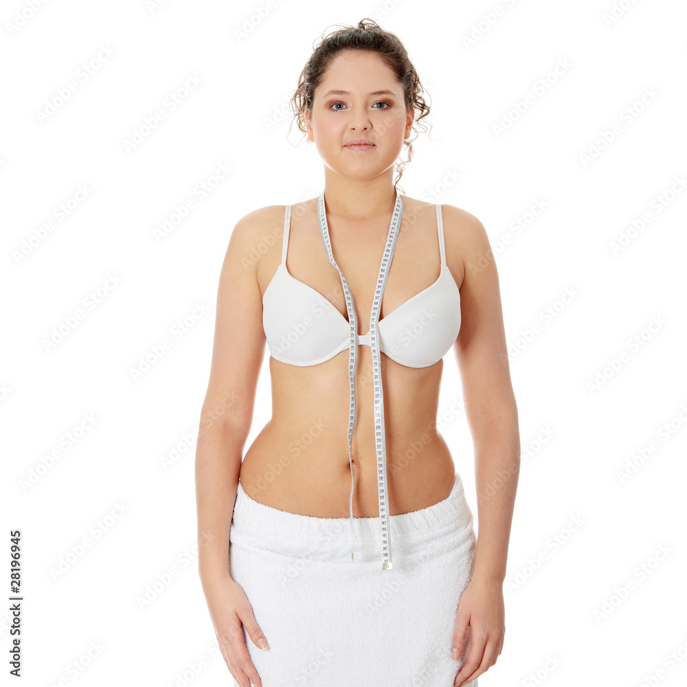 Obraz premium Female measuring her body