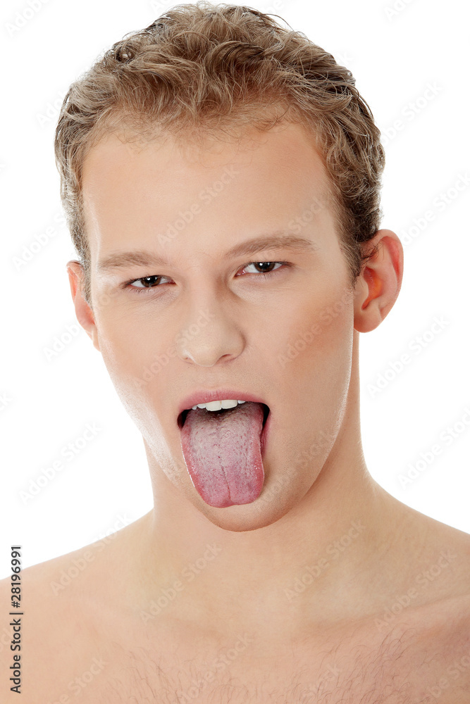 Young handsome man showing tongue Young handsome man showing tongue
