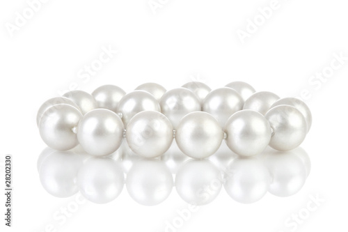 Pearls breads with reflection on white background