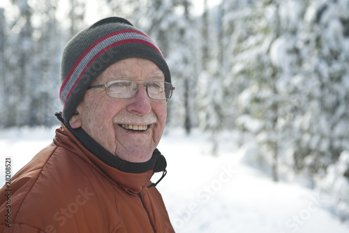 Senior man in snowy winter scene