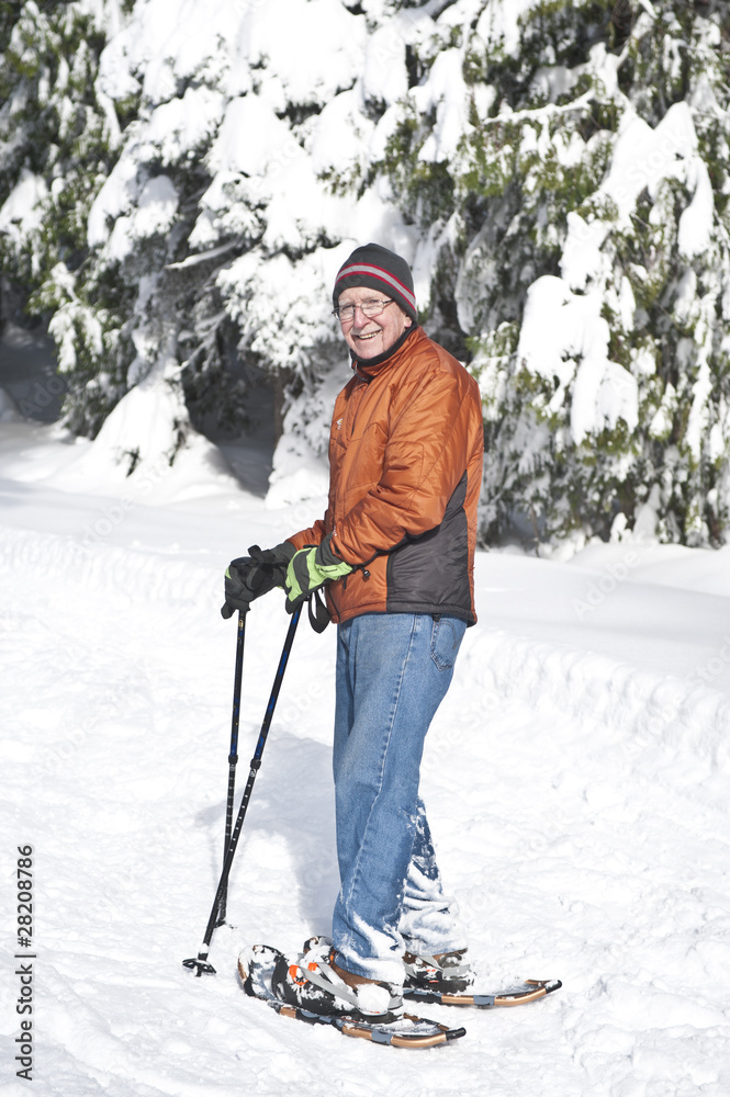 Senior man snowshoeing