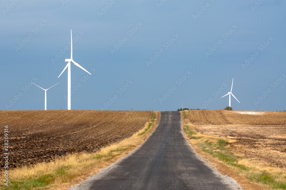Country road and a wind farm