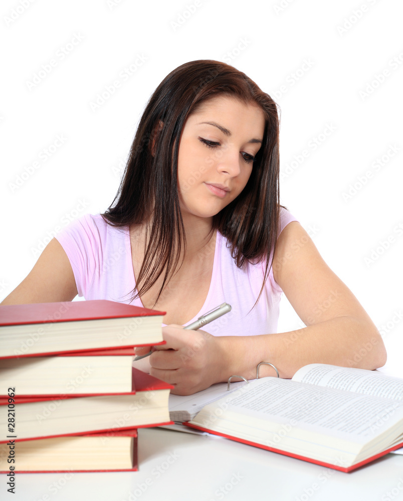 Attraktives Mädchen sitzt gelangweilt am Schreibtisch Attraktives Mädchen sitzt gelangweilt am Schreibtisch