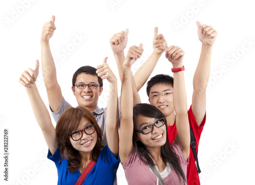Happy students showing thumbs up