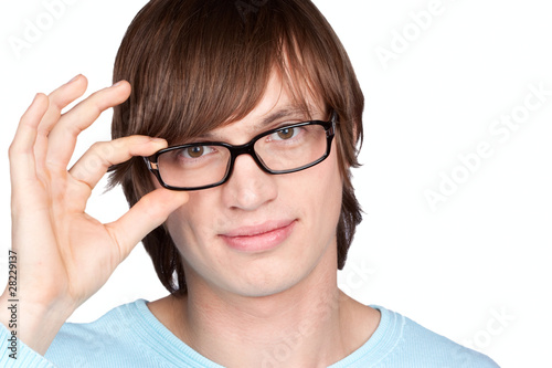 Portrait of young man in glasses isolated on white background