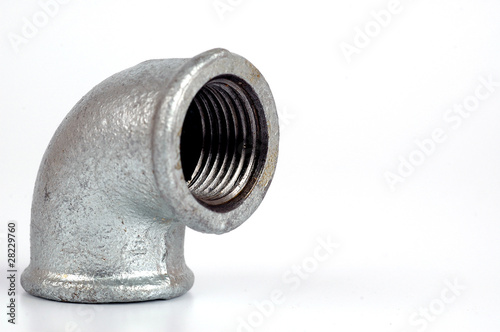 Fotografie Malleable Iron Elbow 90° closeup on the white background