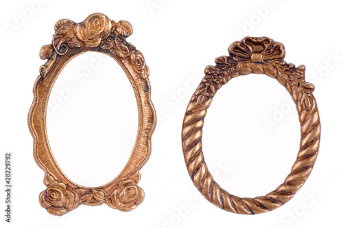 Gold plated and richly decorated frames on a white background