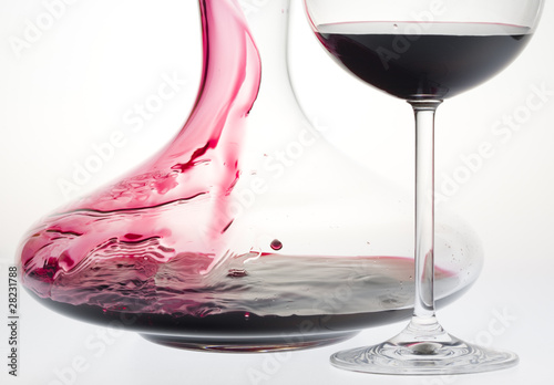 wine glass and carafe with red wine photo