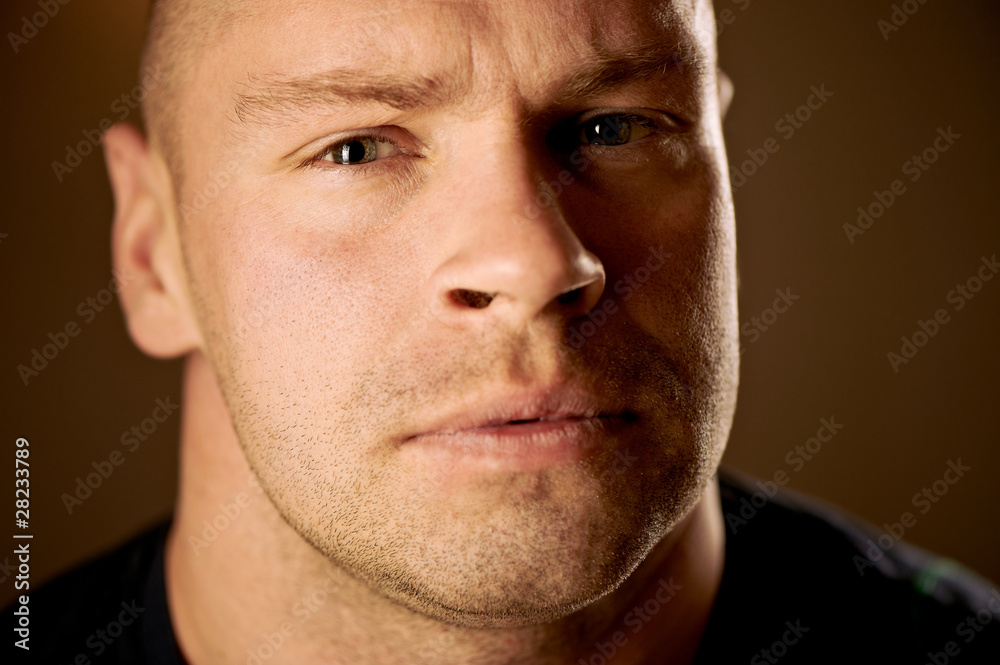 Obraz premium Closeup portrait of a serious handsome young man