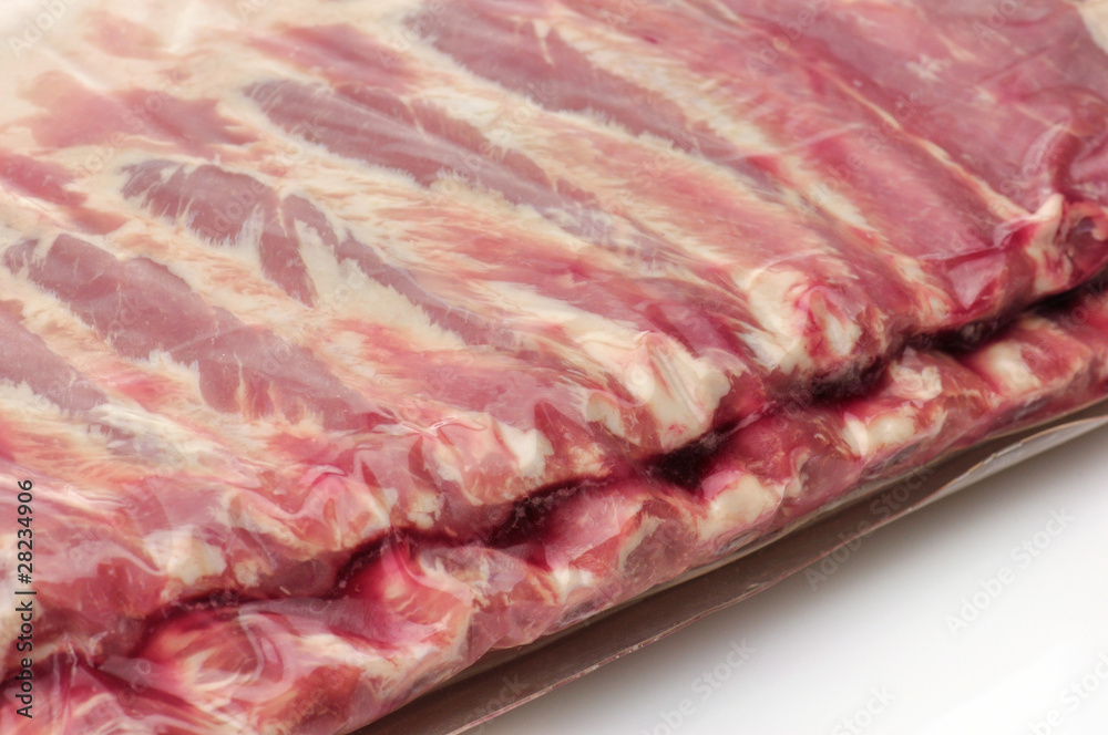 raw ribs in vacuum pacage close up