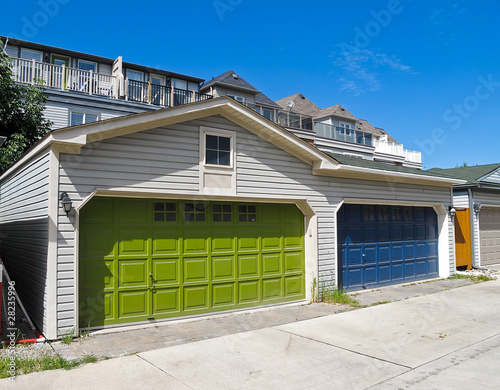 Fotografia Green and Blue Garage Doors