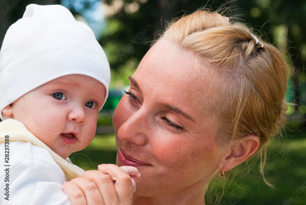 portrait of a happy mom with a child, close-up portrait of a happy mom with a child, close-up