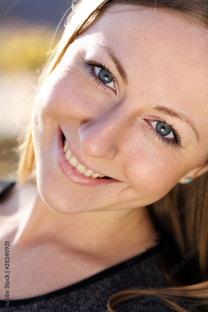 Beautiful young girl smiling. Outdoor portrait Beautiful young girl smiling. Outdoor portrait