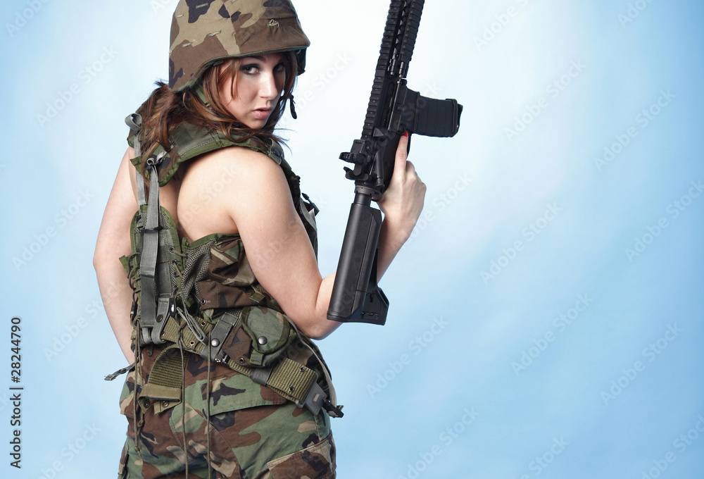 Sexy army woman with assault rifle