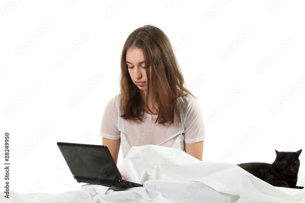Woman in a bed with notebook Woman in a bed with notebook